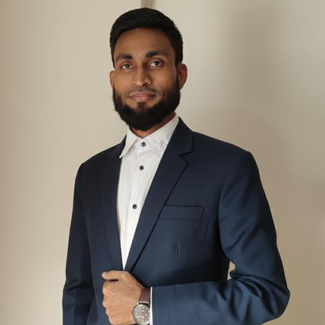 Md. Mohacel Hosen wearing a navy suit